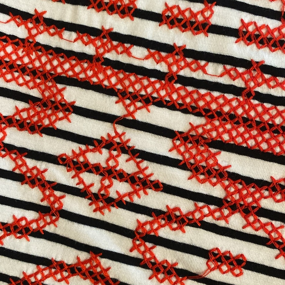 Really cute white with black stripes mini skirt with stitched red X’s - Picture 5 of 5